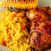 Pin Image: Portuguese rice with peri-peri chicken and corn on a blue plate with text overlaid