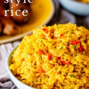 Pin Image: Portuguese rice with peri-peri chicken in background with text overlaid