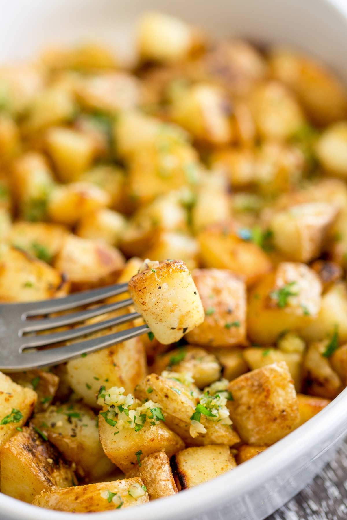 overhead view of crispy potatoes with a fork on top