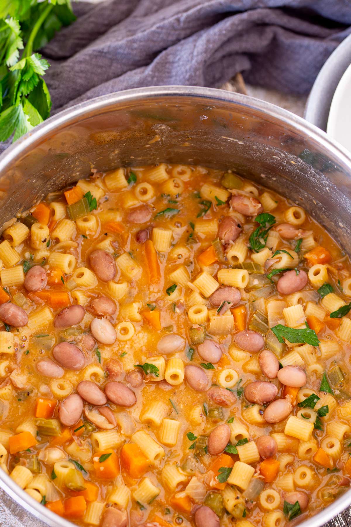 a silver pan full of pasta and bean soup