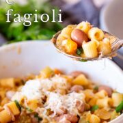 Pin Image: A spoon lifting some Pasta e Fagioli from a bowl with text overlaid