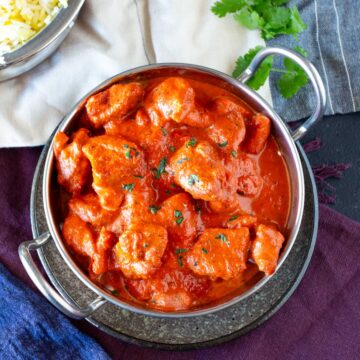 Overhead photograph of Chicken Chasni in a handled curry bowl