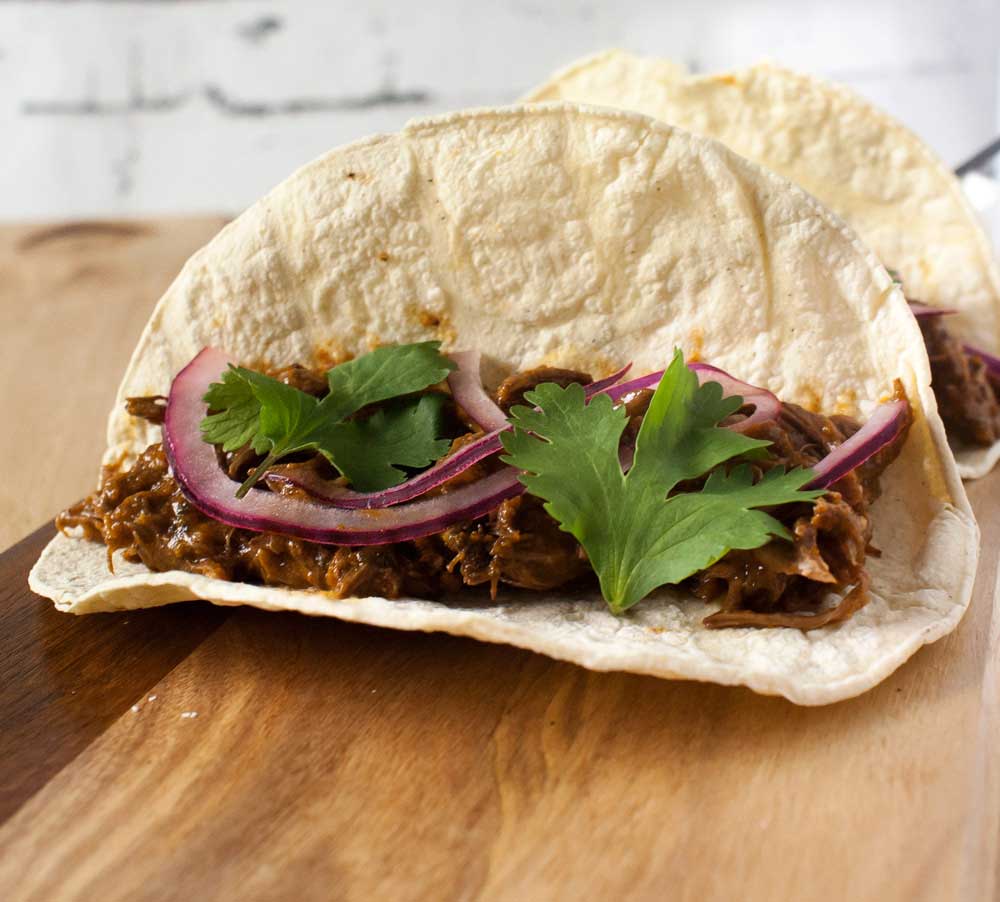Homemade Barbacoa Beef. It's tender, flavorful and prepared in the slow cooker. Perfect for tacos, burritos or quesadillas!