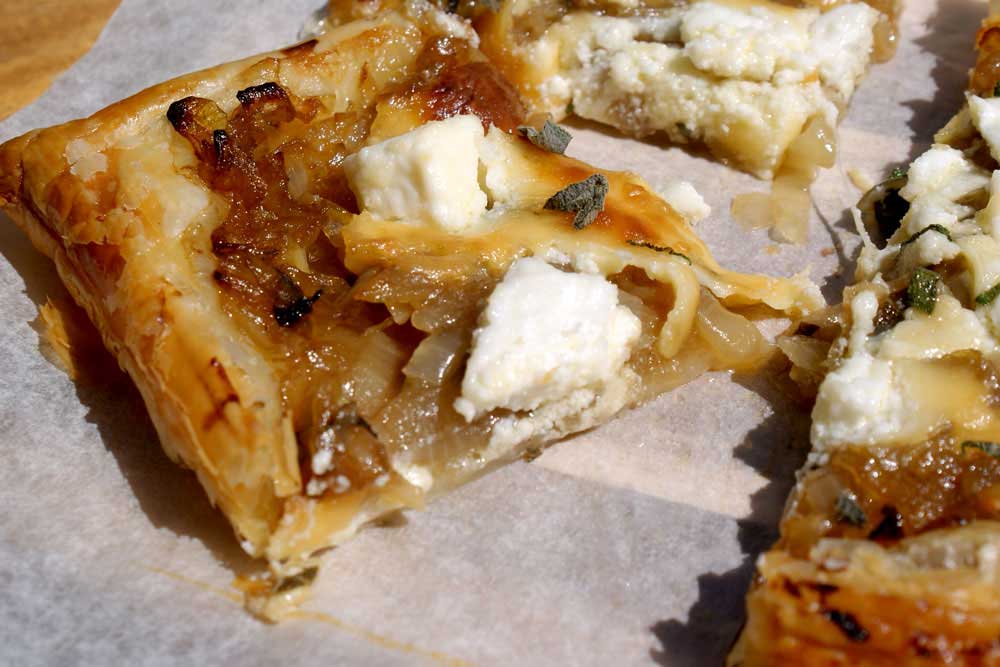 Feta and Sweet Onion Tart. A delicious onion tart with crumbled feta cheese. Perfect served with a salad and a ice cold glass of wine. Easy entertaining.