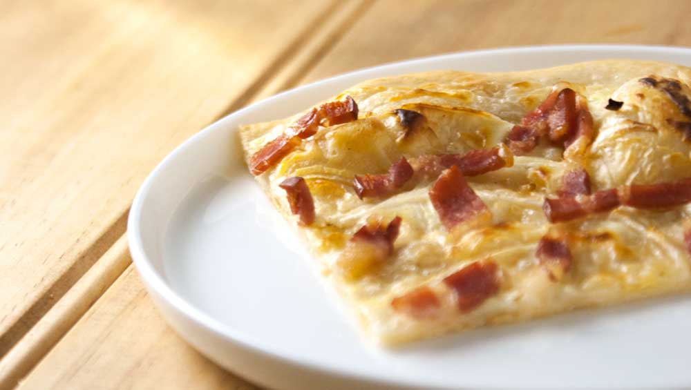 Flammekueche. Bacon and Onion Tart. A delicious French dish from Alsace.