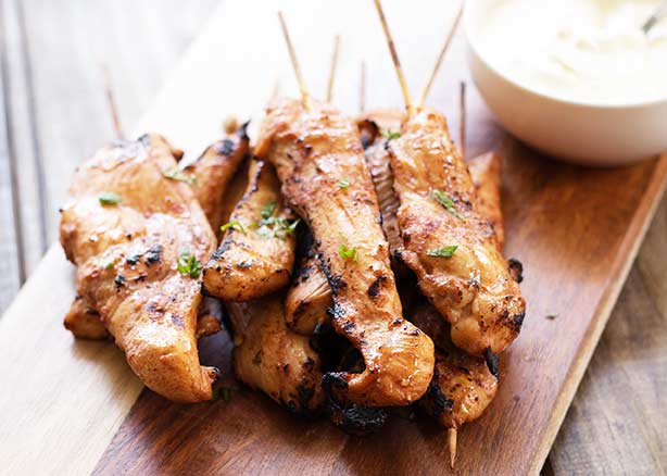 Hot and Spicy Chicken Skewers. These skewers pack a delicious and spicy punch. Perfect for game night or as footie snacks, all washed down with a cold beer! Recipe by Sprinkles and Sprouts | Delicious Food for Easy Entertaining #gameday #partyfood #grilling #outdoorgrilling #chicken