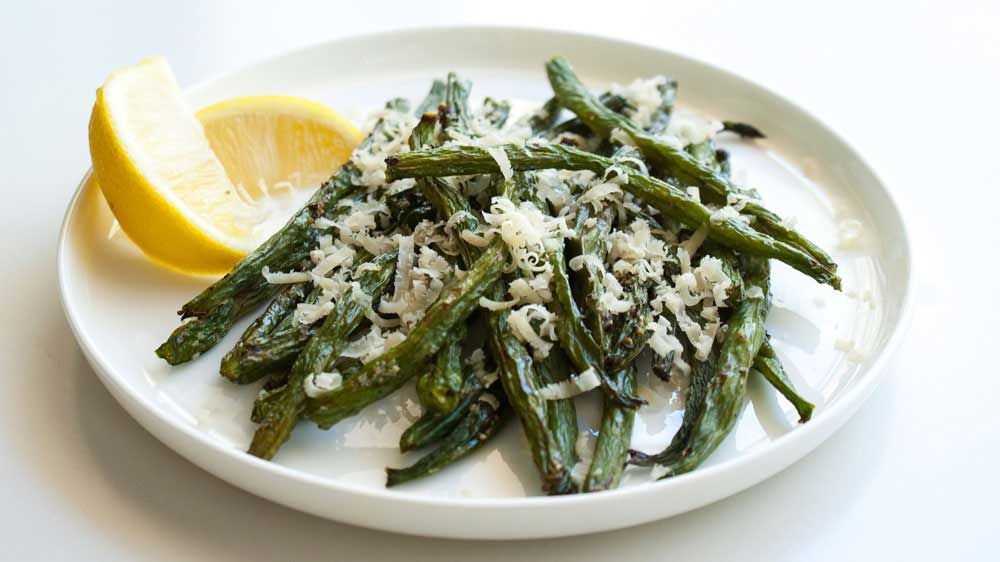 Roasted Green Beans with Parmesan and Rosemary. A great side dish, the beans are tender but crisp and the parmesan and rosemary marry amazingly together.