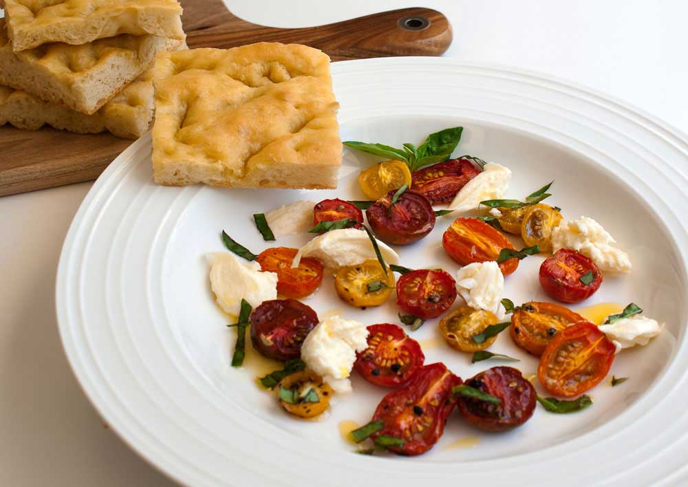 Roasted Tomatoes and Mozzarella Served with Garlic focaccia. A light and summery lunch.