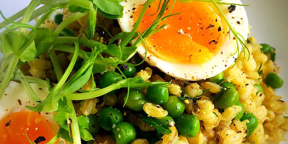 A pearl barley and pea salad. Nutty pearl barley and sweet baby peas, mixed with a lemon maple dressing and served with snow-pea shoots.