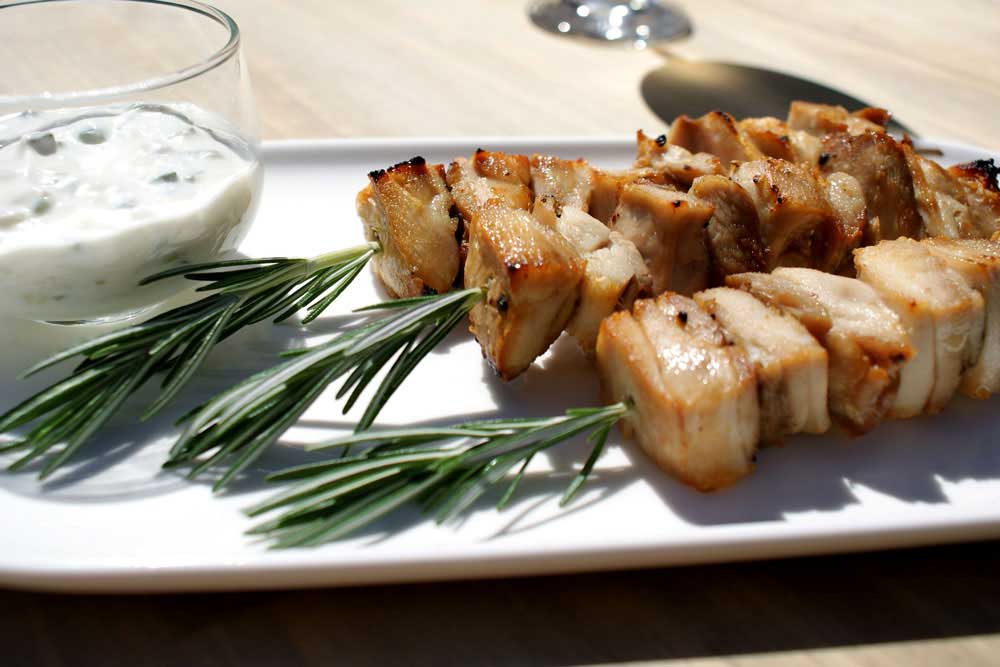 Rosemary Chicken Skewers with Tzatziki. Easy to prepare in advance, this recipe gives you tender chicken with a crisp edge. Perfect for grilling outdoors.