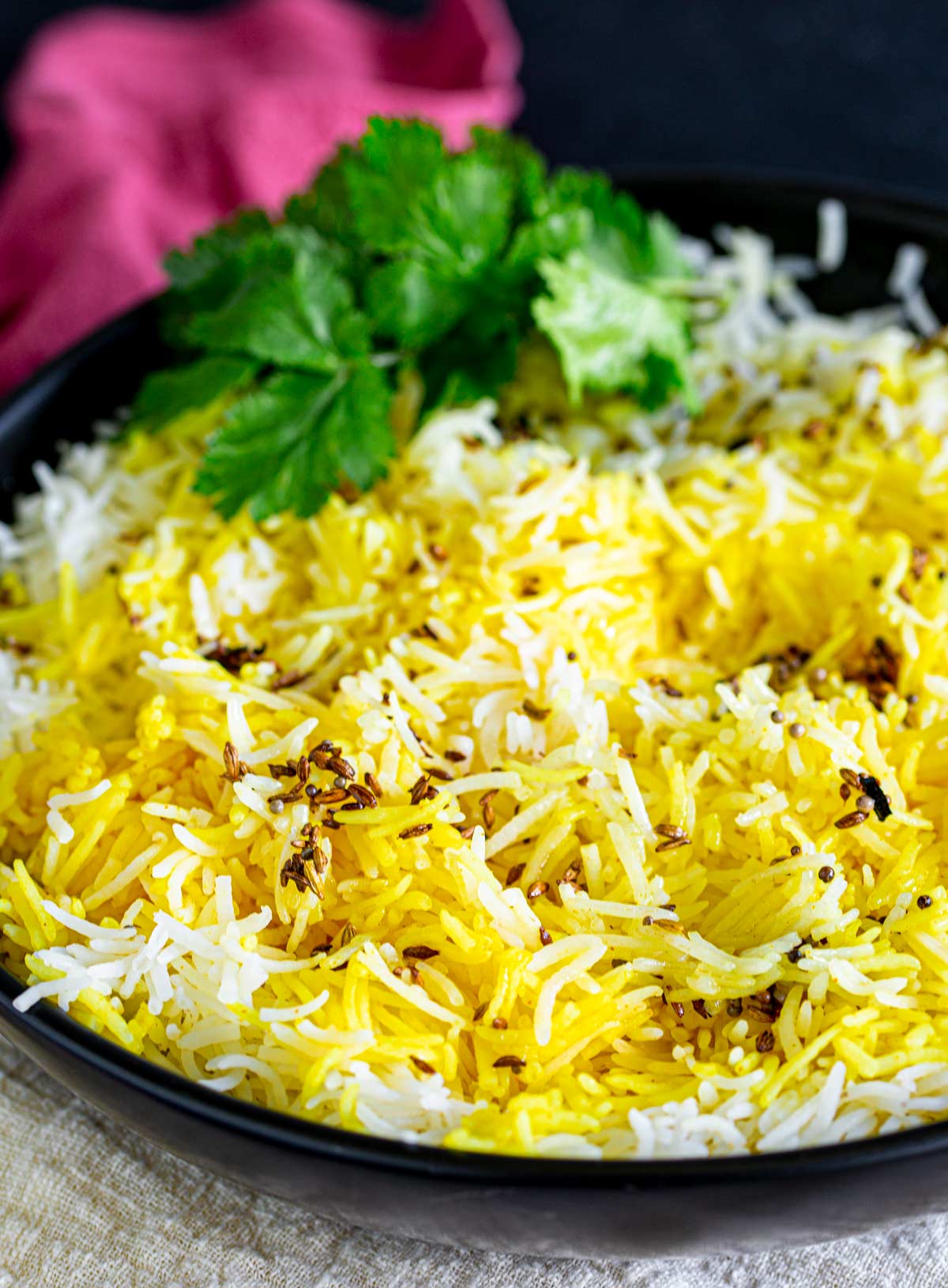 close up of the long grains of yellow basmati rice