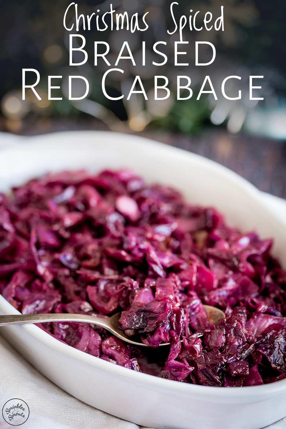 a spoonful of braised red cabbage being lifted from the bowl with text at the top