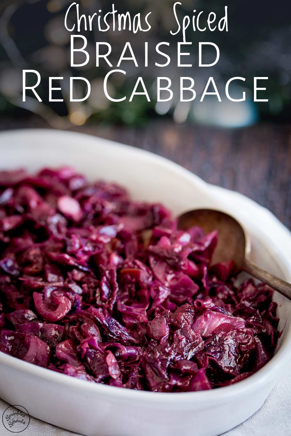 a spoon in the dish of braided red cabbage with text at the tip